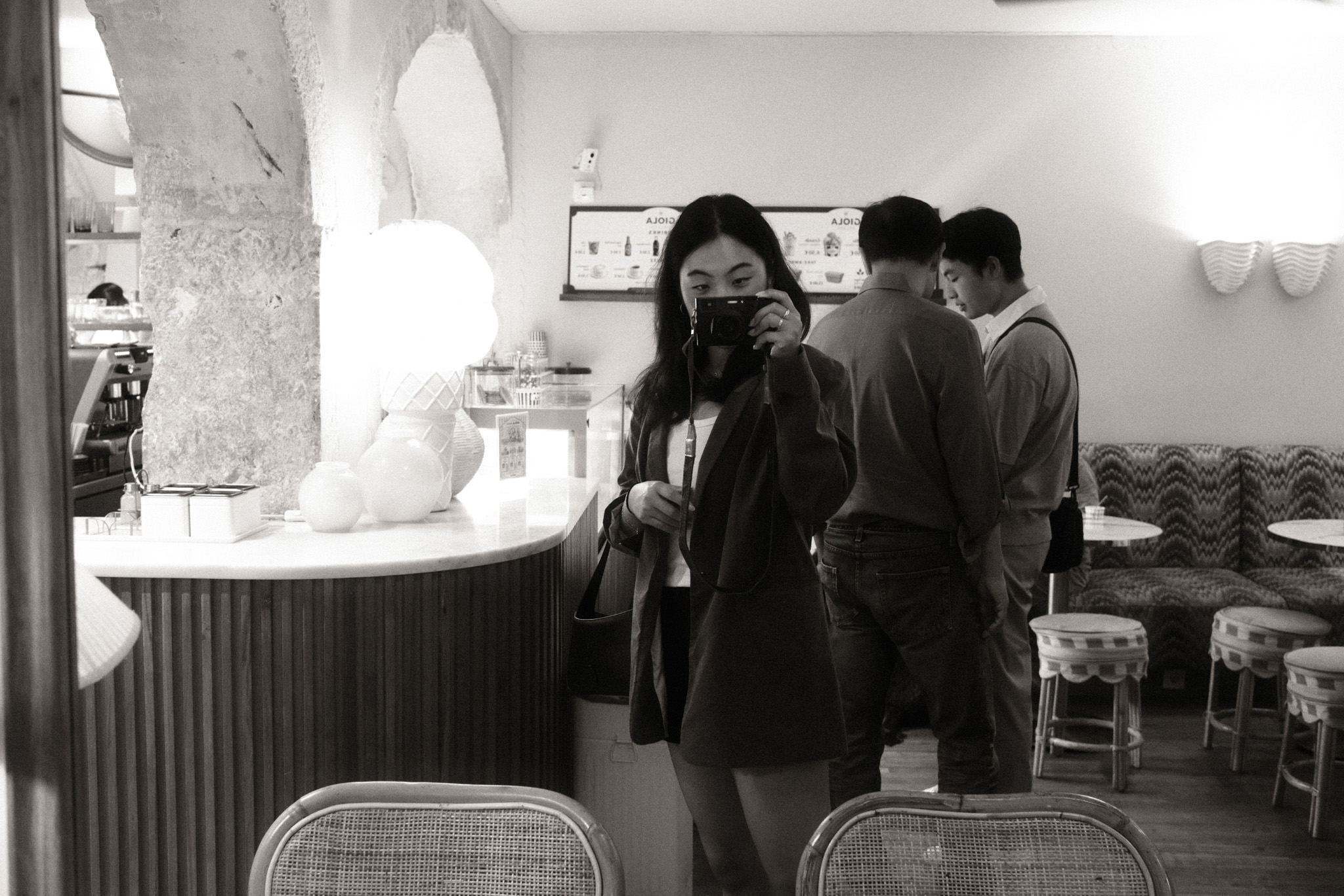 Saebin photographing in a mirror, camera raised